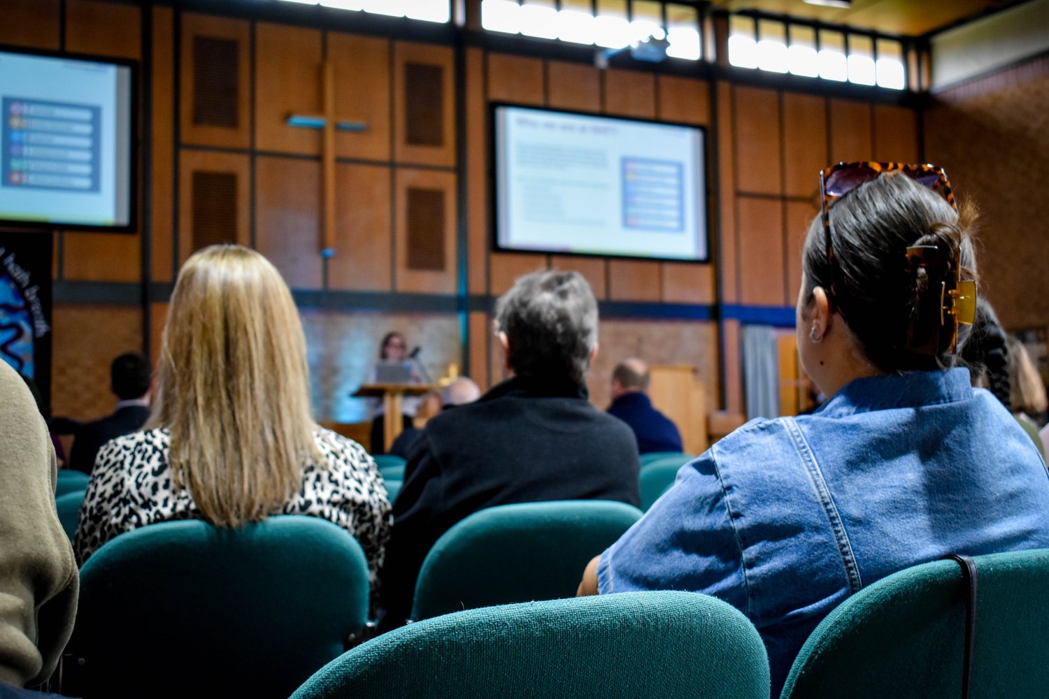 Audience watching a presentation at an Accommodation Concern AGM