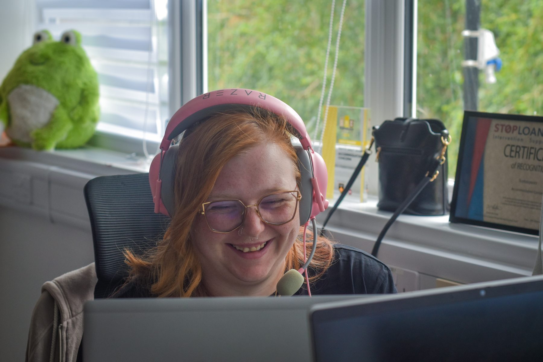 Accommodation Concern adviser wearing a headset at a desk
